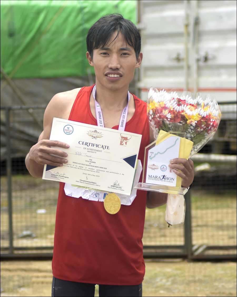 25 year-old Wede Tmero from Chizami village after winning the half marathon.